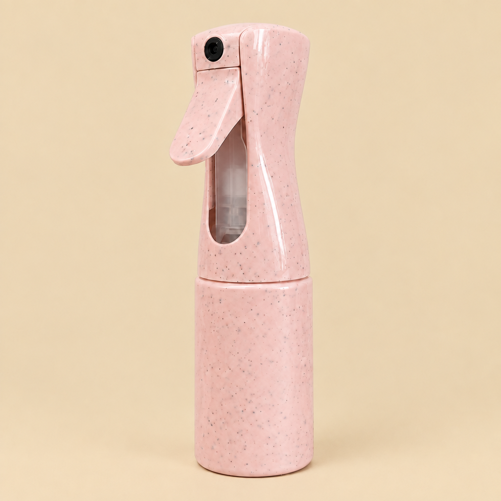 Pink mist bottle with beige background
