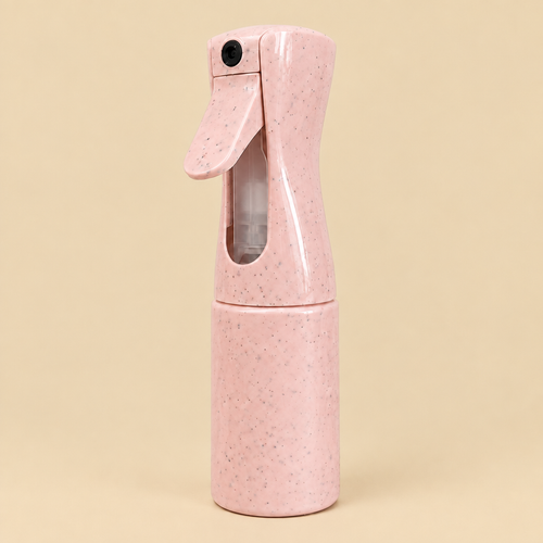 Pink mist bottle with beige background
